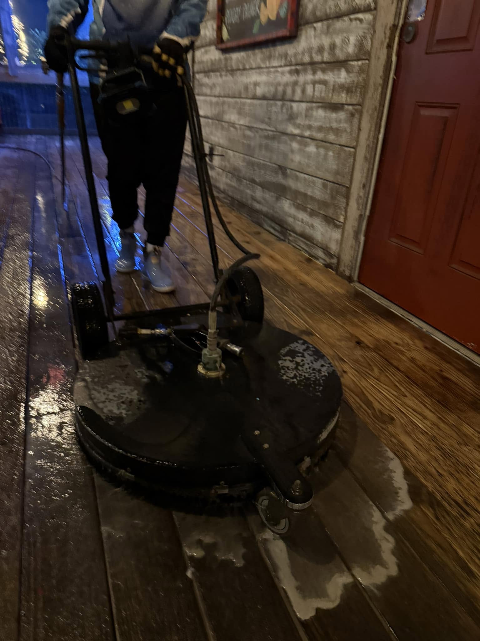 Pressure washing a wood deck